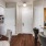 a kitchen with a bar and a dining table