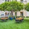 a courtyard with tables and chairs