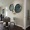 a dining room table seating and art hanging on the wall