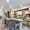 a community kitchen with seating grills and a tv