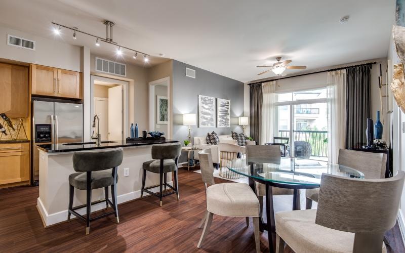 a kitchen with a dining table and chairs