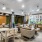 a clubroom with a table, chairs and a couch