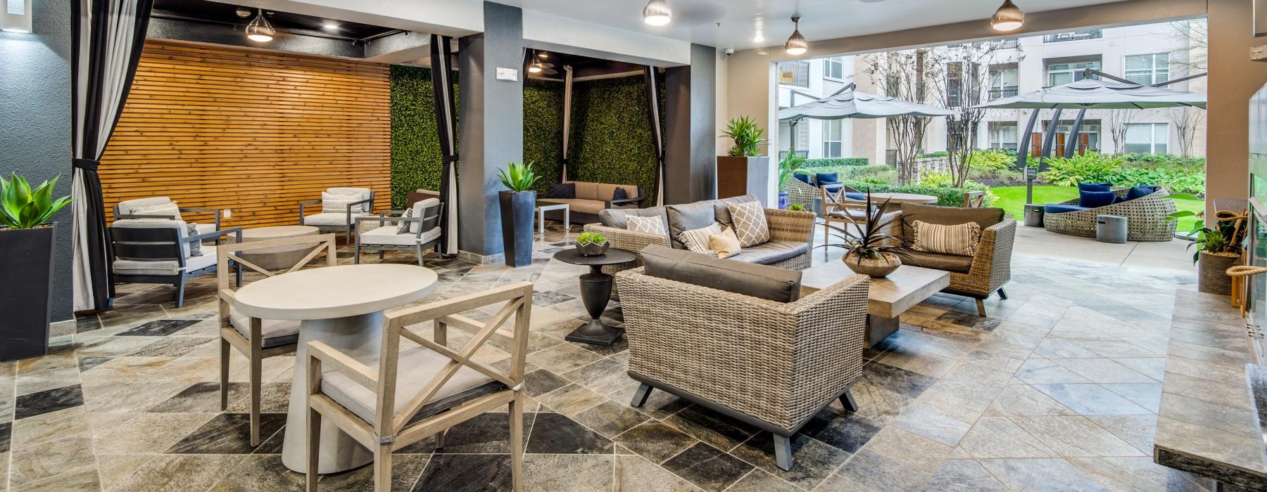 a clubroom with a table, chairs and a couch