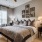 a bedroom with a bed and lamps