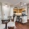 a kitchen with a dining table and chairs