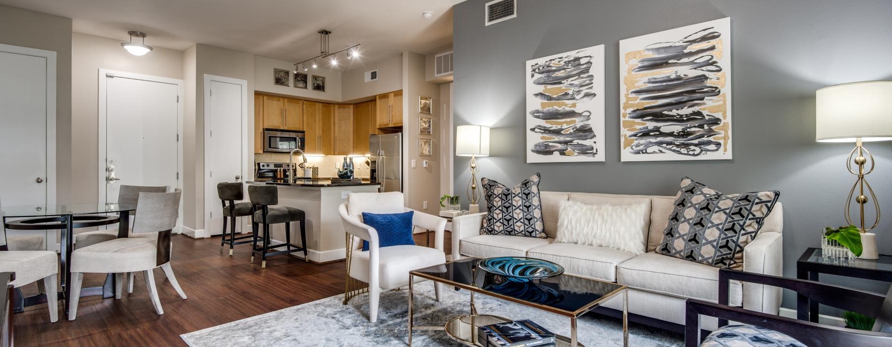 a living room with a couch and chairs