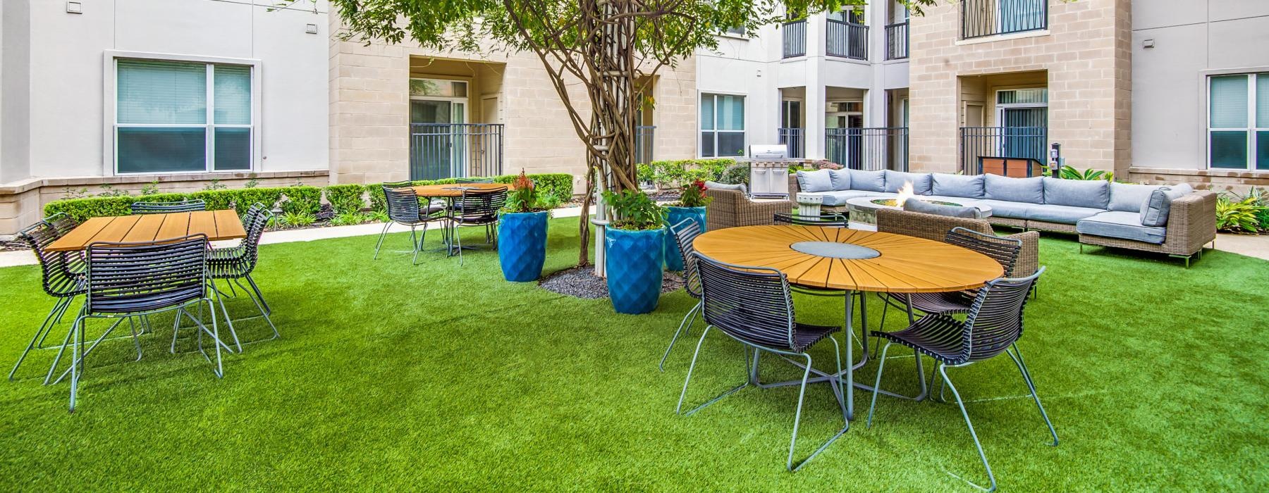 a courtyard with tables and chairs