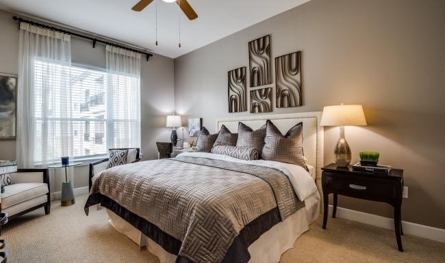 Generous bedroom offerings to fit every family a bedroom with a bed and lamps