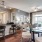 a kitchen with a dining table and chairs